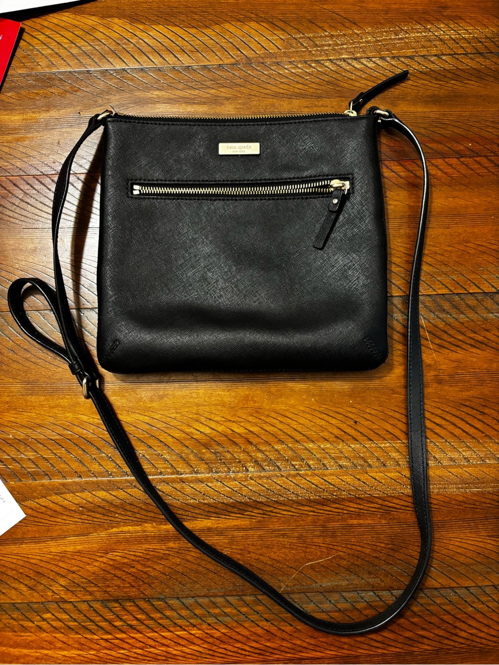 kate spade black crossbody with gold-tone zipper plaque